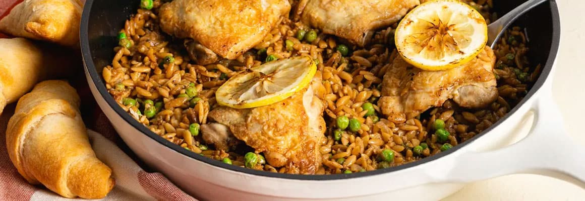 One-pan lemon chicken with orzo and peas, served with crescent rolls.