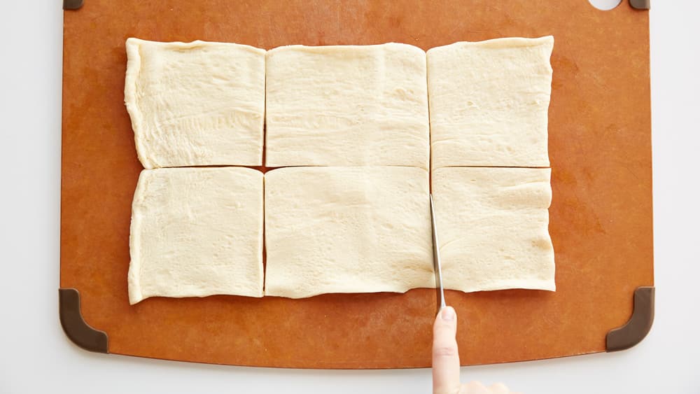 Cut crescent dough sheet into 6 squares