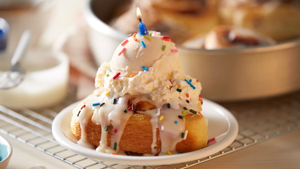 Cinnamon rolls with ice cream and sprinkles