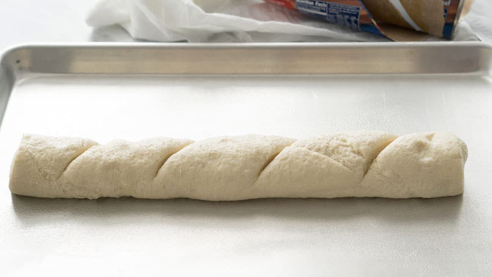 French bread dough on a baking sheet