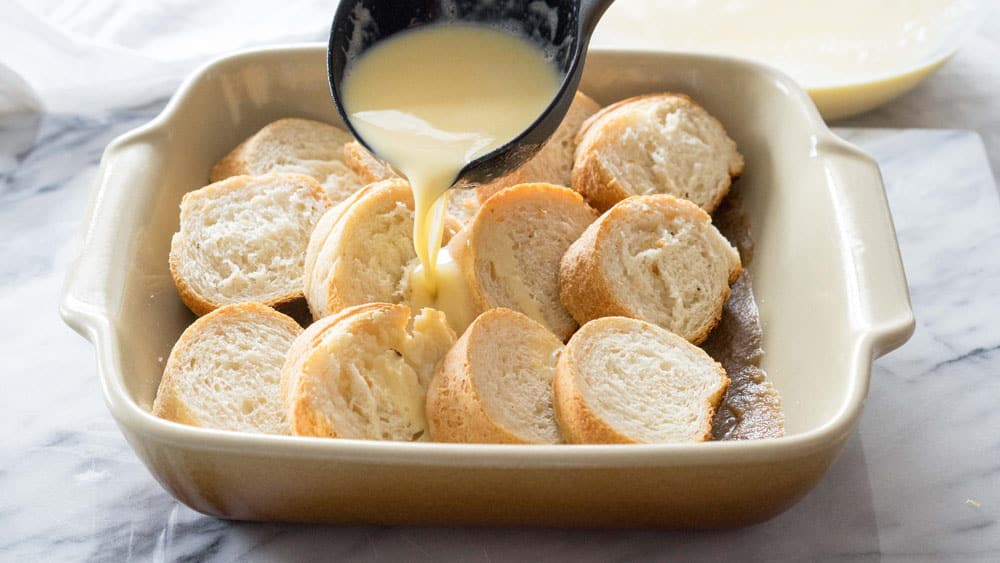 Ladle the custard over the bread.