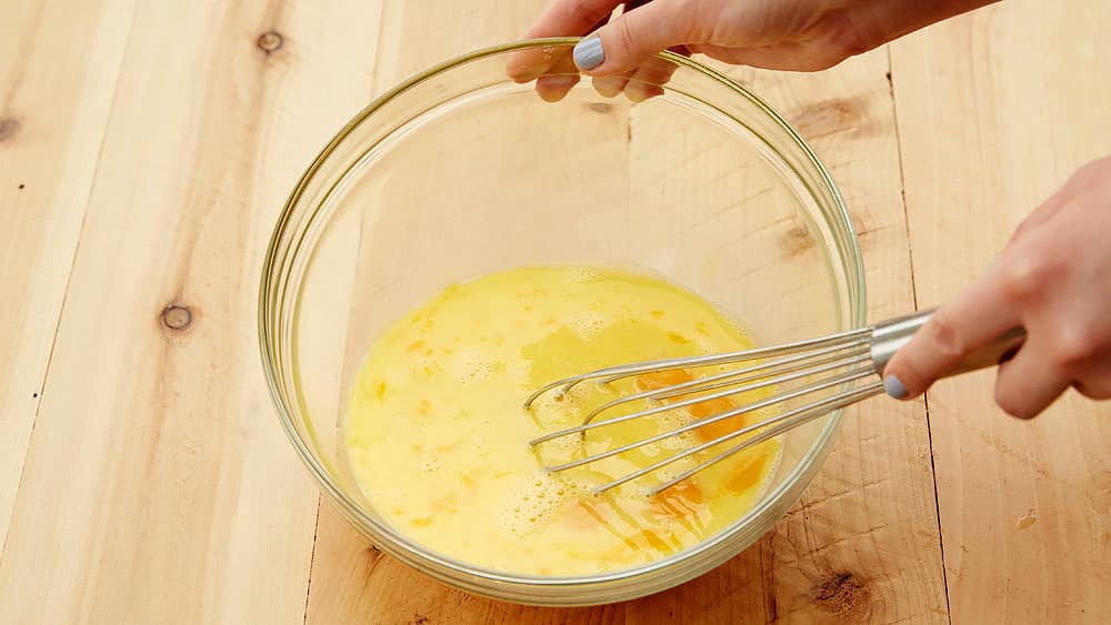 Beat eggs with a wire whisk