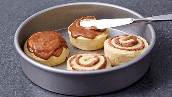 Cinnamon roll dough in a round pan