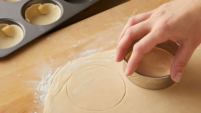 Use a cookie cutter to cut out rounds from pie crust