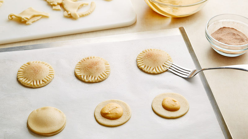 Place your pie filling on top of one cookie round, cover with second round and seal edges with a fork. 