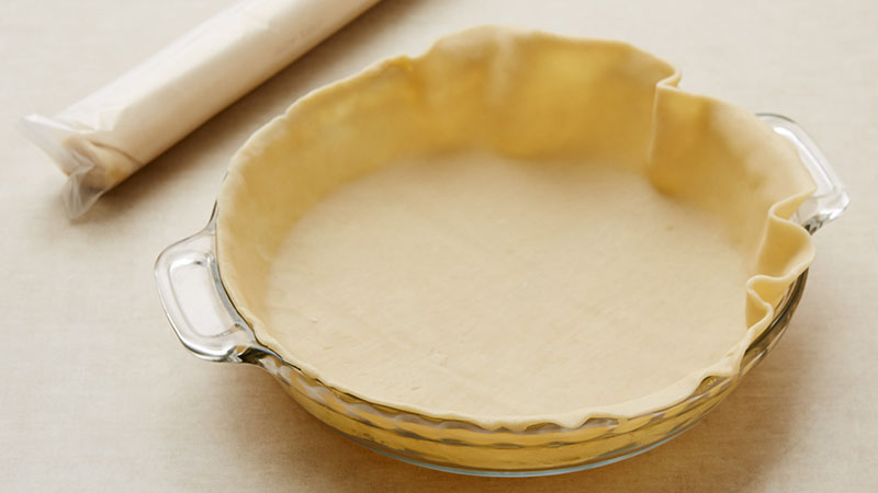 Place 1 pie crust firmly against side and bottom or a 9-inch glass pie plate.