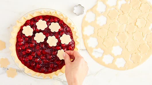 Cherry pie with flower shaped pie crust toppers