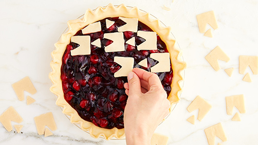 Cherry pie with geometric shaped pie crust toppers