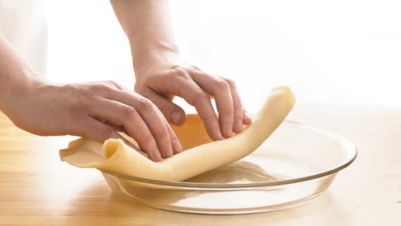 Roll out pie crust into pie pan