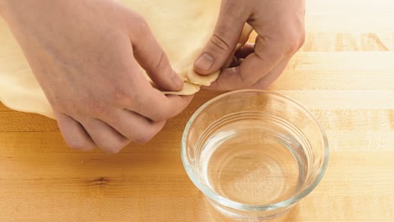 Pinch together cracks in pie crust 