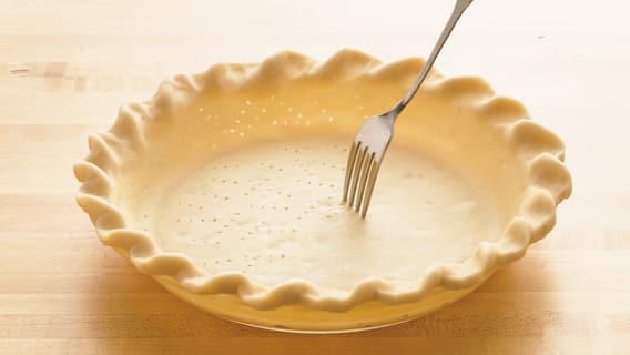 Prick the bottom of the pie crust with a fork