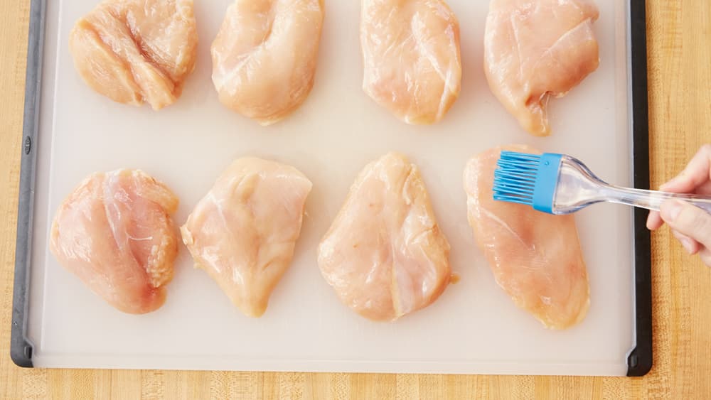 Brush chicken breasts with olive oil