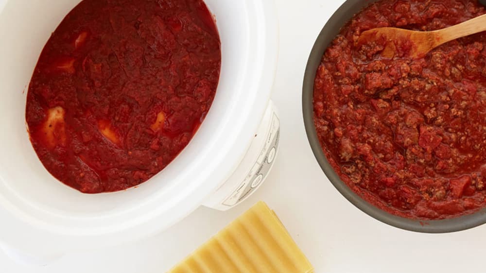 Stir the remaining tomato pasta sauce and other can of tomato sauce into the ground beef.
