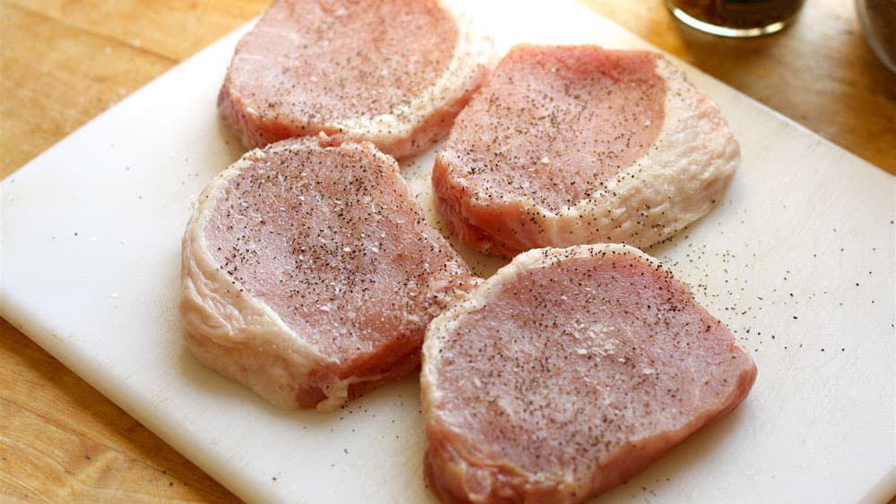 Sprinkle pork chops with salt and pepper