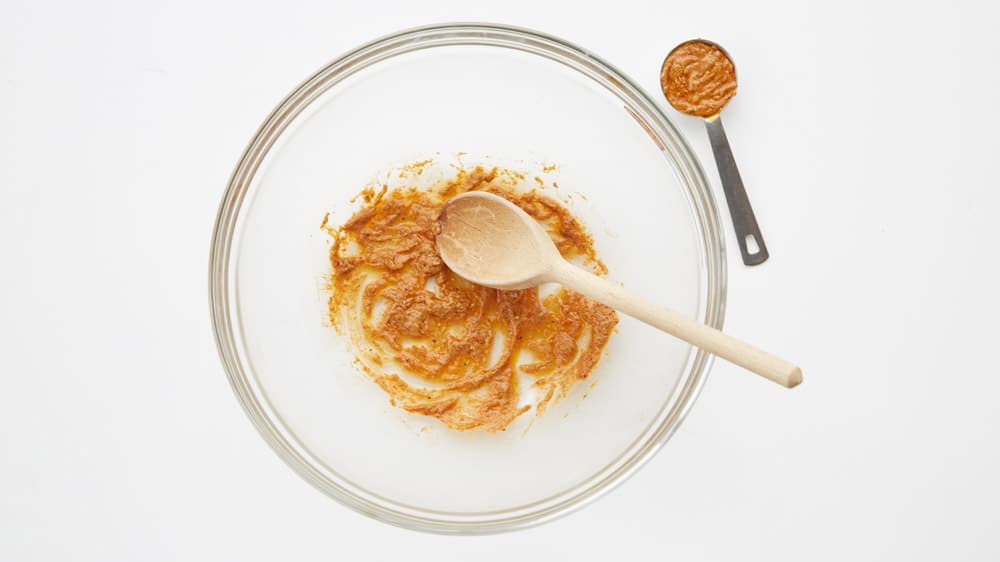 In large bowl, mix 2 tablespoons Dijon mustard, 2 tablespoons olive oil, and spices.