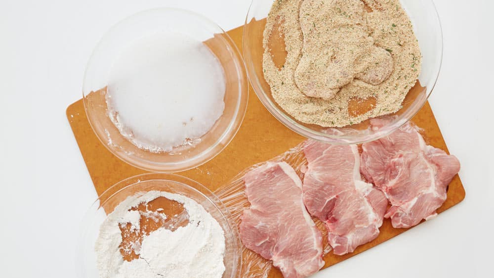 Dip each pork chop in flour mixture, then dip in milk, and finally in breadcrumbs. 