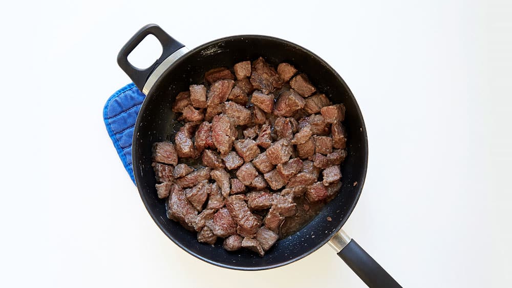 Brown beef in a 10-inch skillet