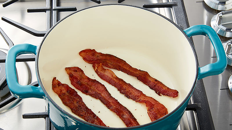 Cook the bacon in a Dutch oven.