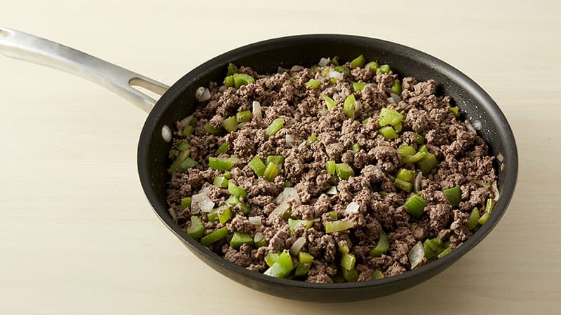 Cook ground beef, onions, celery and bell pepper in a skillet.
