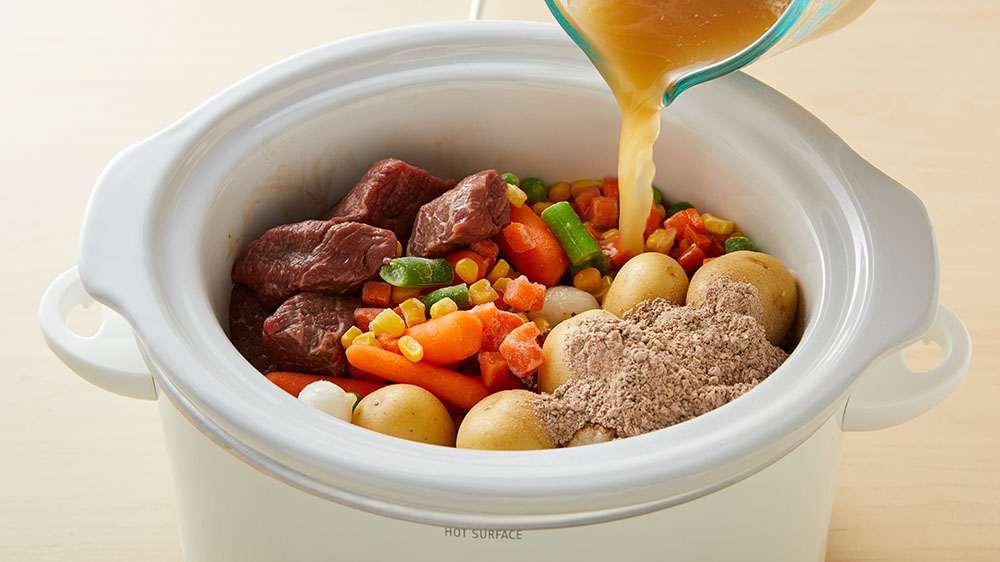 Stew meat, mixed vegetables, baby yellow potatoes, seasoning, broth in a slow cooker