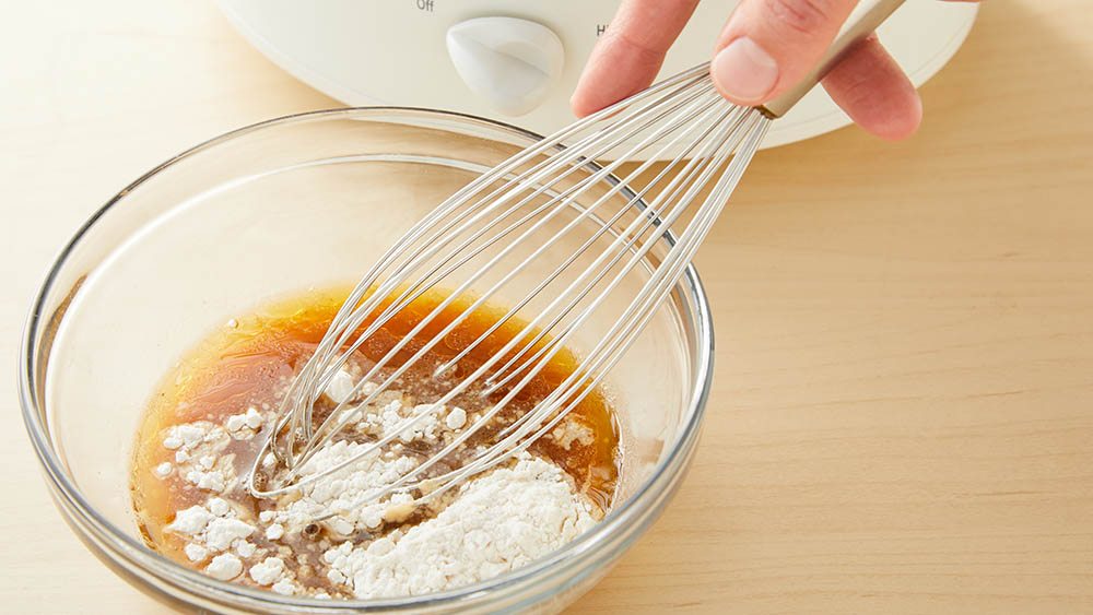 Whisk together broth and flour
