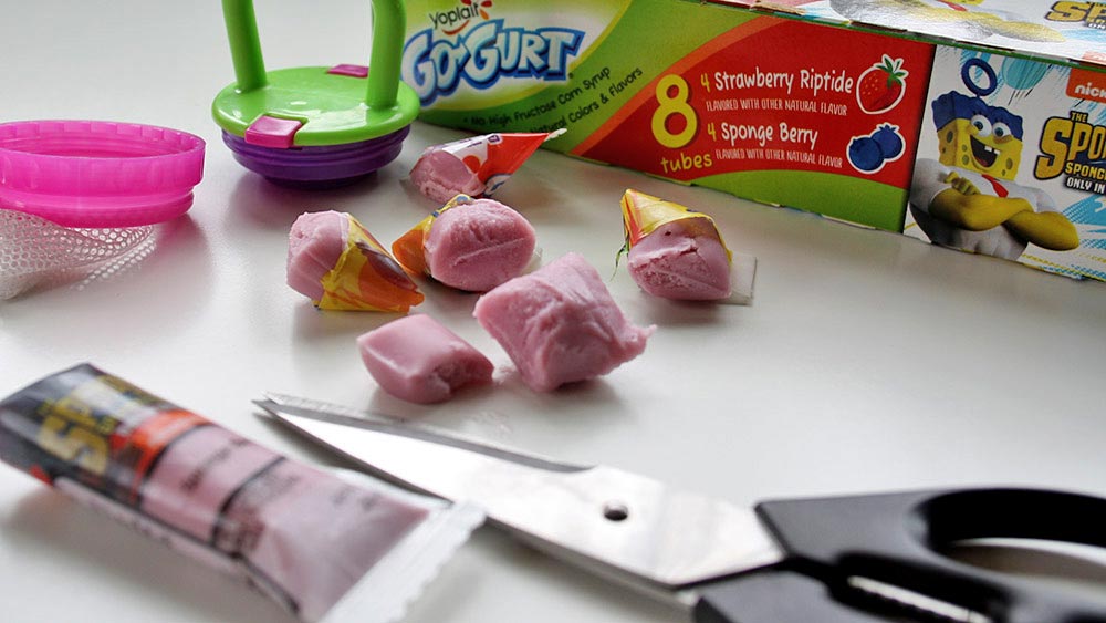 A frozen Go-Gurt cut into several bite-sized chunks