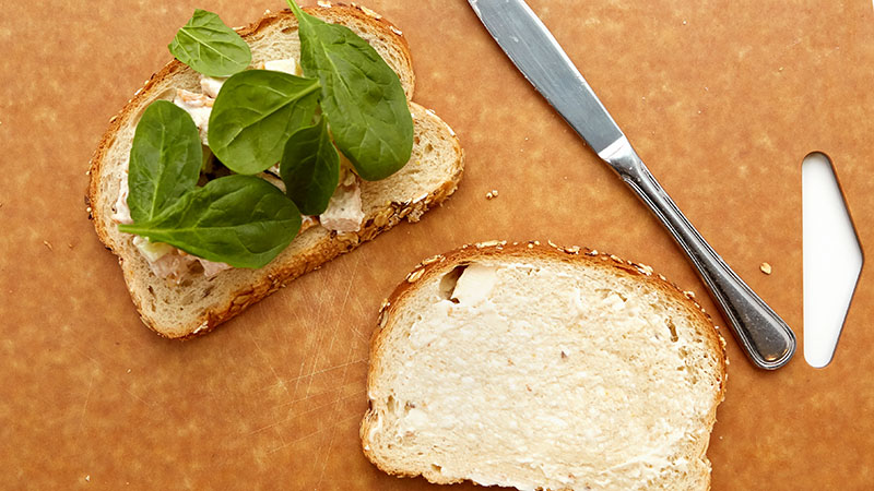 Spread about ½ cup chicken mixture on each of four slices of bread. Arrange spinach leaves over chicken mixture. Spread each remaining bread slice with one teaspoon mayonnaise. 