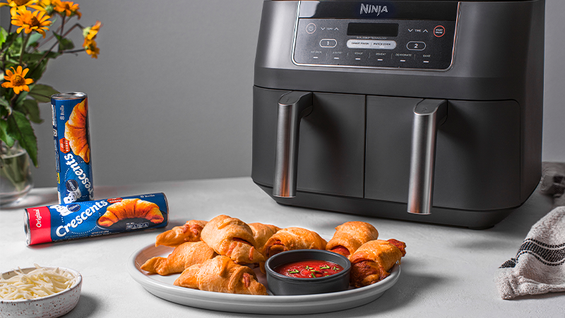 https://www.pillsbury.com/-/media/GMI/Core-Sites/PB/PB/Images/everyday-eats/other/double-the-delicious-with-half-the-dishes/Pizza-Crescents.png?sc_lang=en?W=800