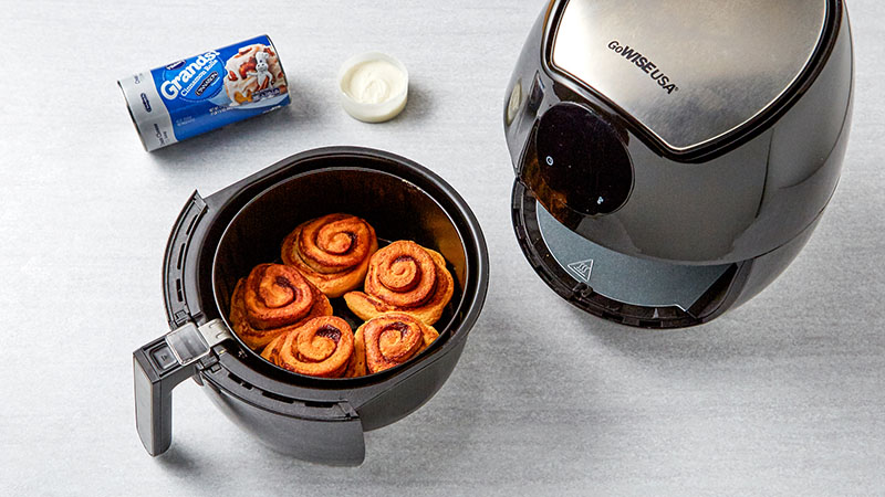 Grands cinnamon rolls in an air fryer after cooking