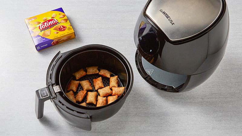 Pizza rolls in an air fryer after cooking