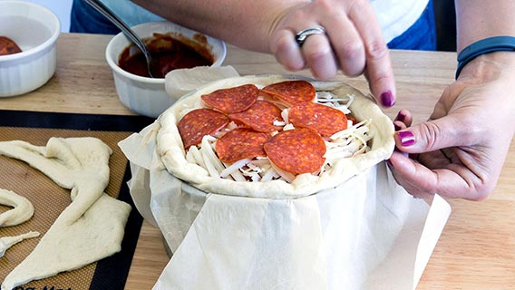 Topping pizza cake with slices of pepperoni
