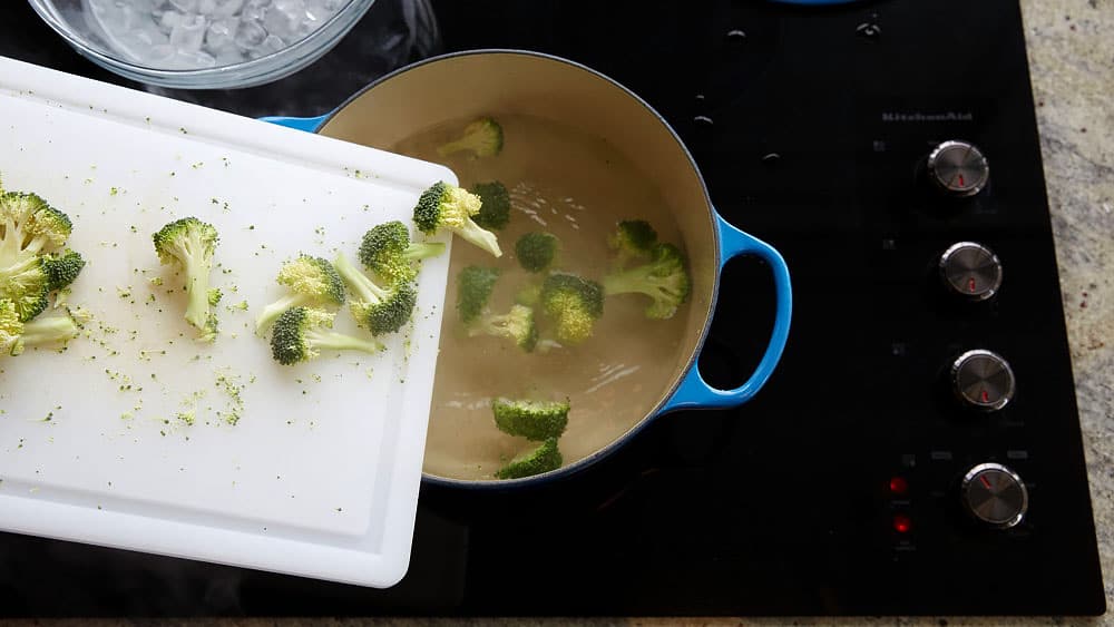 Add chopped broccoli to boiling water.