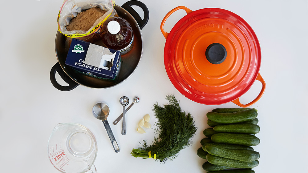 Pot, canning jars, pickling cucumbers, apple cider vinegar, brown sugar, salt, garlic, dill