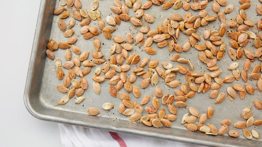 Pumpkin seeds on a sheet pan