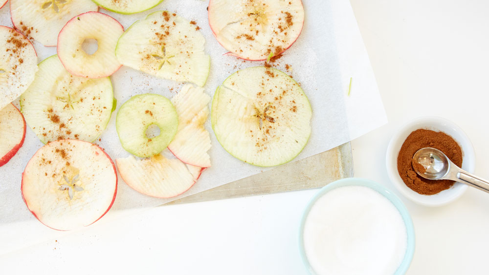 Sliced apples sprinkled with cinnamon and sugar