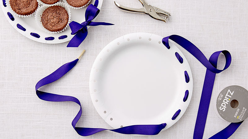 Paper plates with blue ribbons
