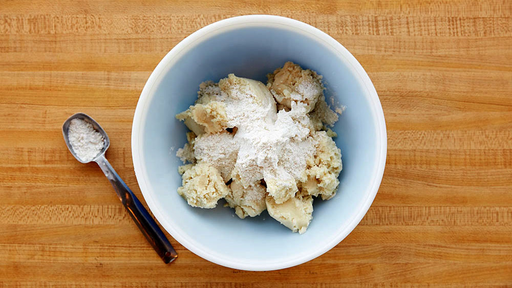 Cookie dough and flour in a bowl