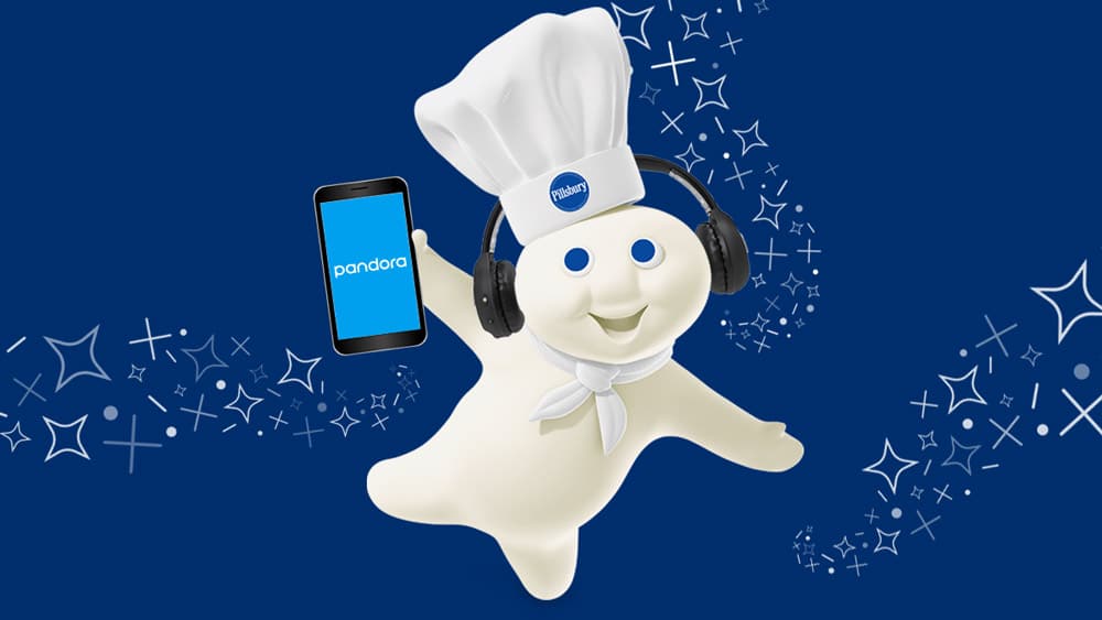 Doughboy with headphones and an iphone with Pandora