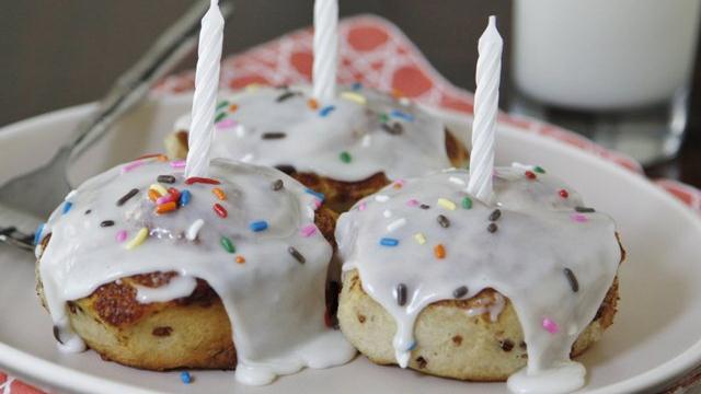 birthday cinnamon rolls with sprinkles and birthday candles