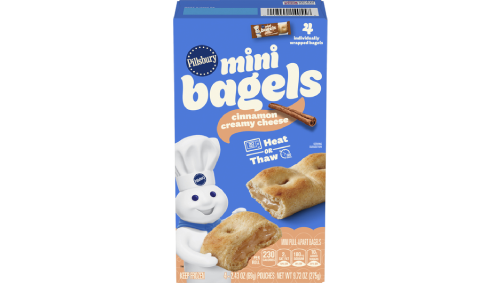 Box of Pillsbury™ Mini Bagels (cinnamon cream cheese) with Doughboy and bagel images on blue packaging.